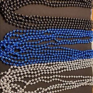 Mardi gras beads. In black, blue and silver.